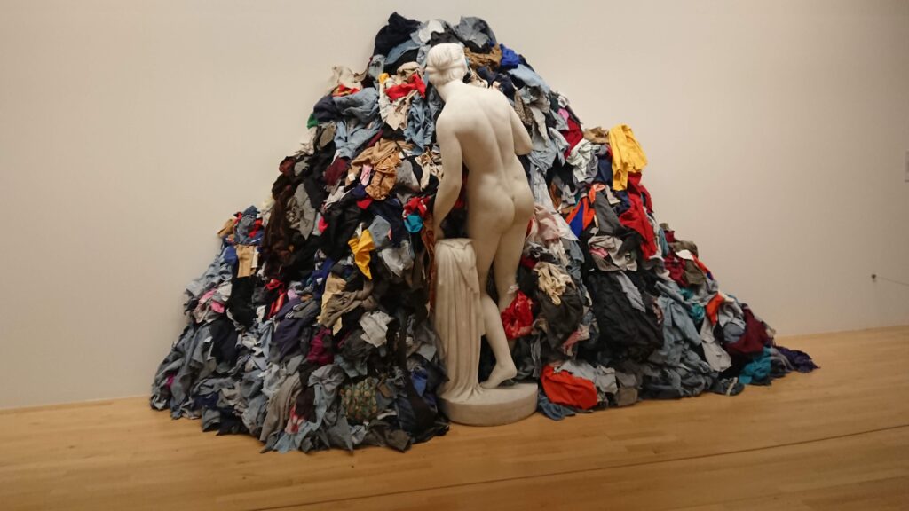 Statue surrounded by clothes